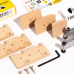 Pieces of the Candylab diy wooden car building toy set spread out on a white background
