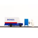 Candylab wooden diecast post van on a black rubber road next to a toy figure and mailbox toy