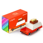 Candylab handmade wooden luggage wagon diecast car on a white background next to its box