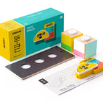 Pieces of the Candylab collectable taco shack model on a white background next to its cardboard box