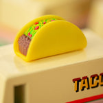 Close up of the miniature taco on top of the Candylab kids handmade wooden taco van toy