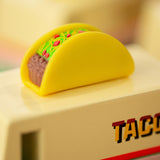 Close up of the miniature taco on top of the Candylab kids handmade wooden taco van toy