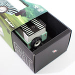 Close up of the Candylab kids wooden diecast suv toy car in its cardboard box on a white background