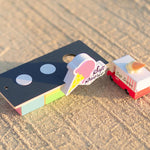 Candylab eco-friendly ice cream shack and ice cream van toys on a sandy background
