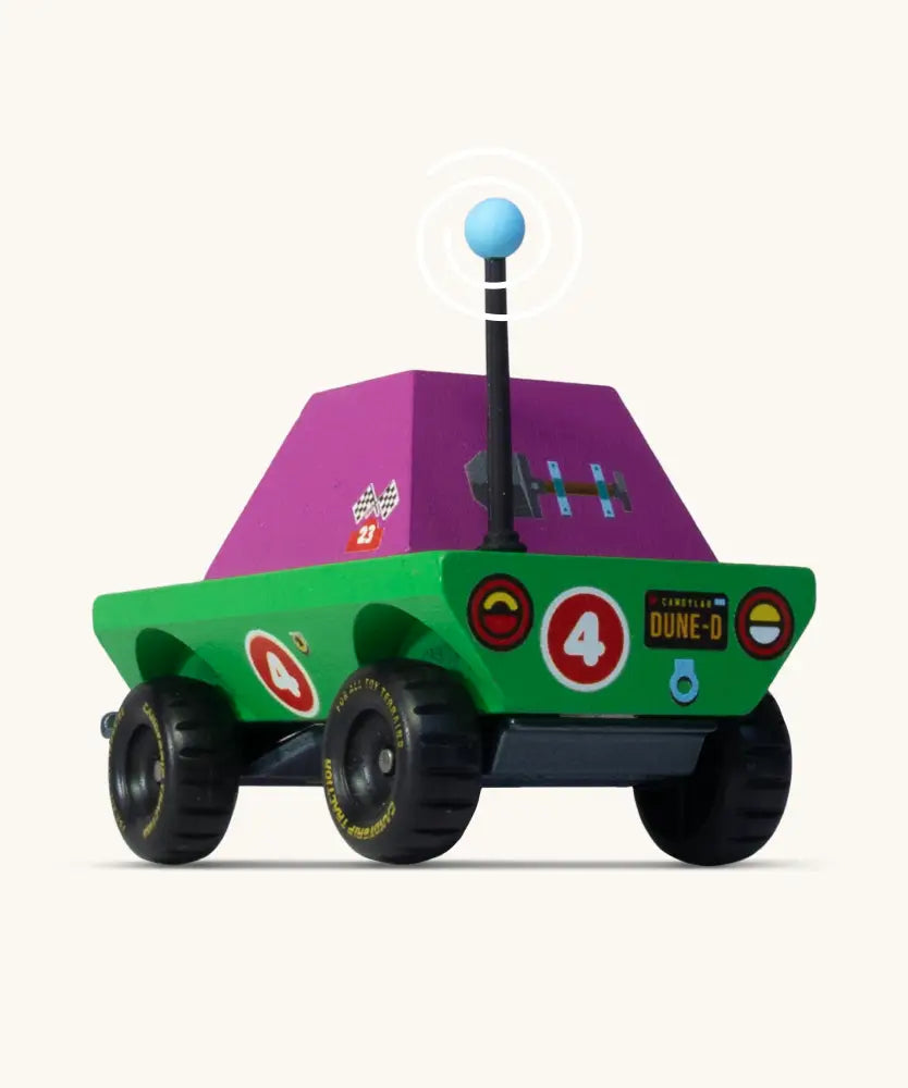 Back of Candylab Dundee wooden diecast adventurer truck with a green body and purple windows and decals
