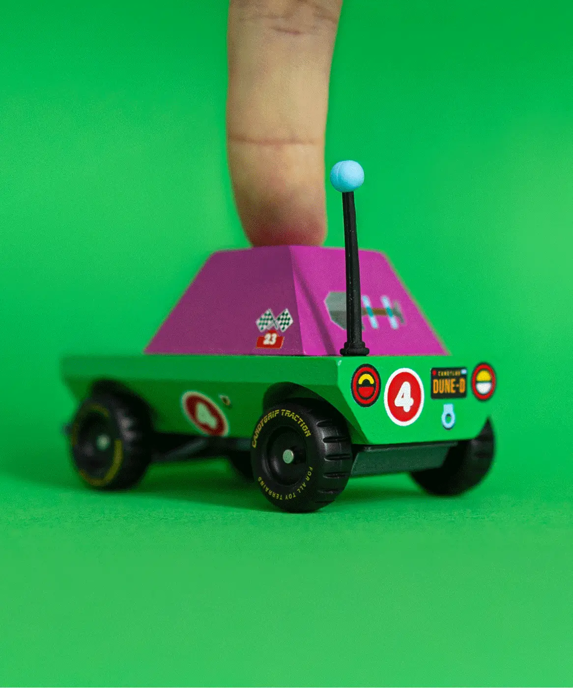 Adult finger on top of the Candylab Dundee adventurer truck showing scale