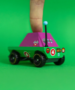 Adult finger on top of the Candylab Dundee adventurer truck showing scale