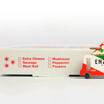 Close up of the Candylab kids toy pizza delivery truck on a red and black pizza box