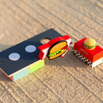 Candylab toy burger shack and burger van on a sandy background