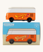 CandyLab orange VW T1 Campervan with 'Groovy' text on the side in a 60s font - side view placed on top of its original packaging.