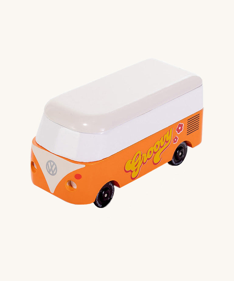 CandyLab orange VW Campervan with 'Groovy' text on the side, in a 60s font - front view. 