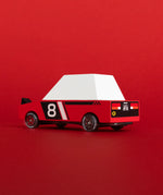 Candylab Hachigo red racer a red body, pop up headlights and retro no8 decals in front of a bright red car