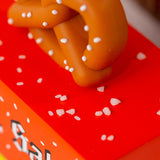 Close up of small slat grains on top of the Candylab toy pretzel van toy