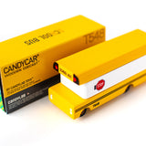 Candylab wooden bus toy on a rubber road set next to some pink and grey toy cars