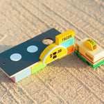 Candylab kids wooden taco van and taco shack toys on a sandy background