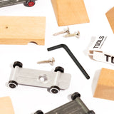 Pieces of the candylab childrens wooden car building kit scattered on a white background