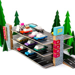 Candylab eco-friendly childrens vehicle parking garage toy on a white background next to some green toy trees