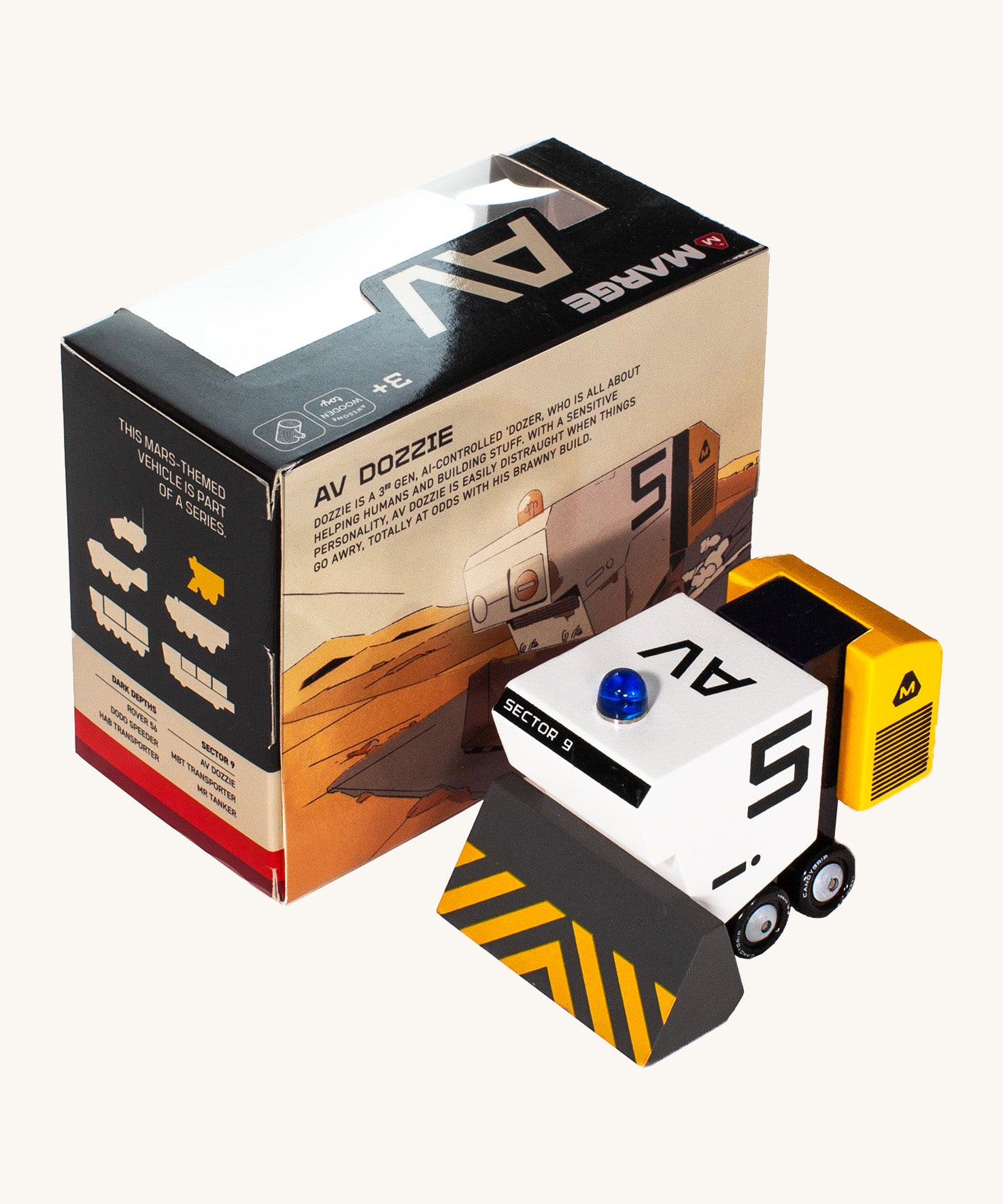 CandyLab AV M.A.R.G.E space vehicle - placed next to original cardboard box packaging.