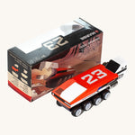 CandyLab red and white DODO M.A.R.G.E Speeder space vehicle next to the original cardboard packaging.