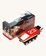 CandyLab red and white DODO M.A.R.G.E Speeder space vehicle next to the original cardboard packaging.