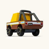 Back of Candylab mud coyote truck. A wooden diecast toy car showing the roll cage and retro decals