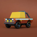 Front of Candylab mud coyote toy truck showing yellow window, roll cage and retro decals