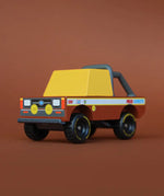 Front of Candylab mud coyote toy truck showing yellow window, roll cage and retro decals