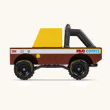 Side of Candylab mud coyote toy truck showing yellow window, roll cage and retro decals
