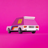 Back of the Candylab pink 62 racer toy car with a white body, pink windows and decals against a bright pink background