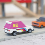 Candylab wooden diecast pink 62 racer toy car on a play road with another car in the background