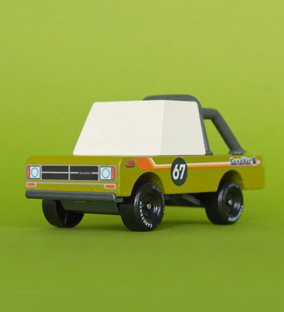 Front of Candylab sand kat adventure truck showing retro decals on the side panel