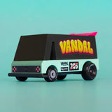 Candylab seafoam vandal van showing black and aqua body with a pink spoiler and retro decals in front of a blue background