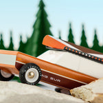 Close up of the Candylab eco-friendly wooden big sur car toy on some large rocks