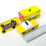 Candylab childrens wooden toy taxi on a white background next to a metal ruler and its yellow box
