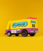 Side of a Candylab speed vandal toy van showing yellow and purple body, pink spoiler and retro decals