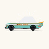 Side of a Candylab teal tora racer toy car showing the yellow spoiler and retro decals 