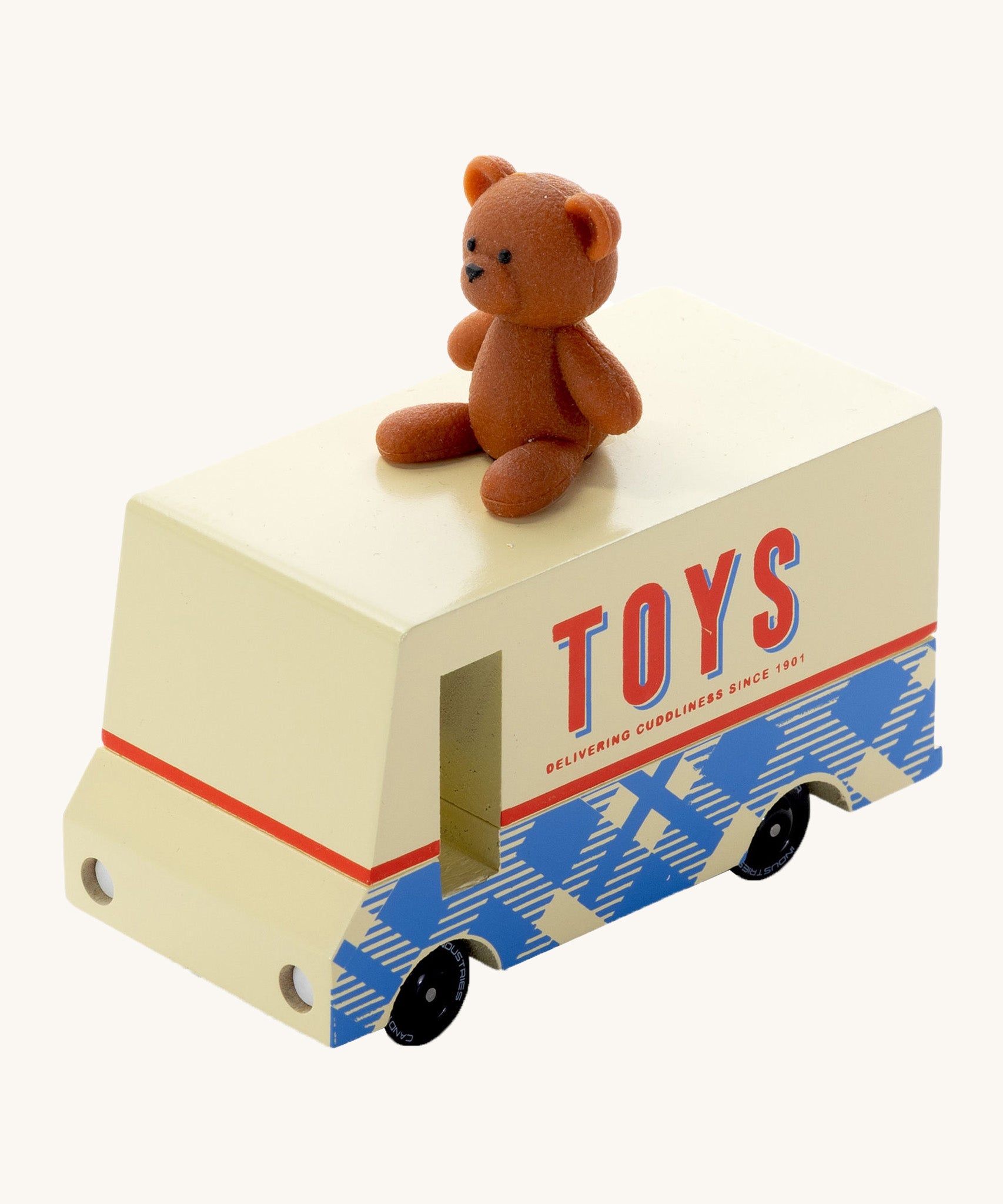 CandyLab cream and blue CandyVan with a brown teddy bear on the roof with Toys text logo in red on the side - front view.