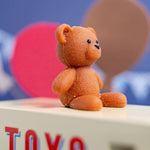 CandyLab cream and blue CandyVan - close up of the teddy bear.