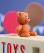CandyLab cream and blue CandyVan - close up of the teddy bear.