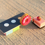 Close up of the Candylab toy donut shack on a sandy background