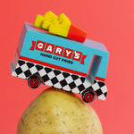 Candylab French Fry Candyvan car toy on top of a potato on a red background