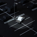 Candylab wooden mouserod toy car in a dark toy carpark under a bright spotlight