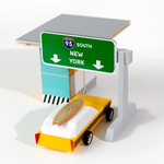The Candylab toy car wooden toll booth toy, with a candylab car driving through.