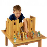 Child playing with the Lanka Kade Castle Play set & 12 Knights.