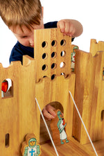 Child playing with the Lanka Kade Castle Play set & 12 Knights.
