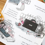 Pages of The Cats Who Wanted More childrens book open on a wooden background showing illustrations of cats and humans in front of a laptop