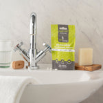 Picture of Ecoliving chewable mouthwash tablets on a bathroom sink.