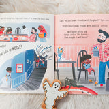 Pages of the No Home for a Ghost kids story book open on a white fluffy blanket