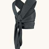 Close Caboo cotton blend Baby Carrier in phantom back view, showing wide shoulder straps and tie waist adjustment strap 