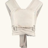Close Caboo Lite Baby Carrier in Blush cream front view, showing wide shoulder straps, ring adjustment, and soft front panel.